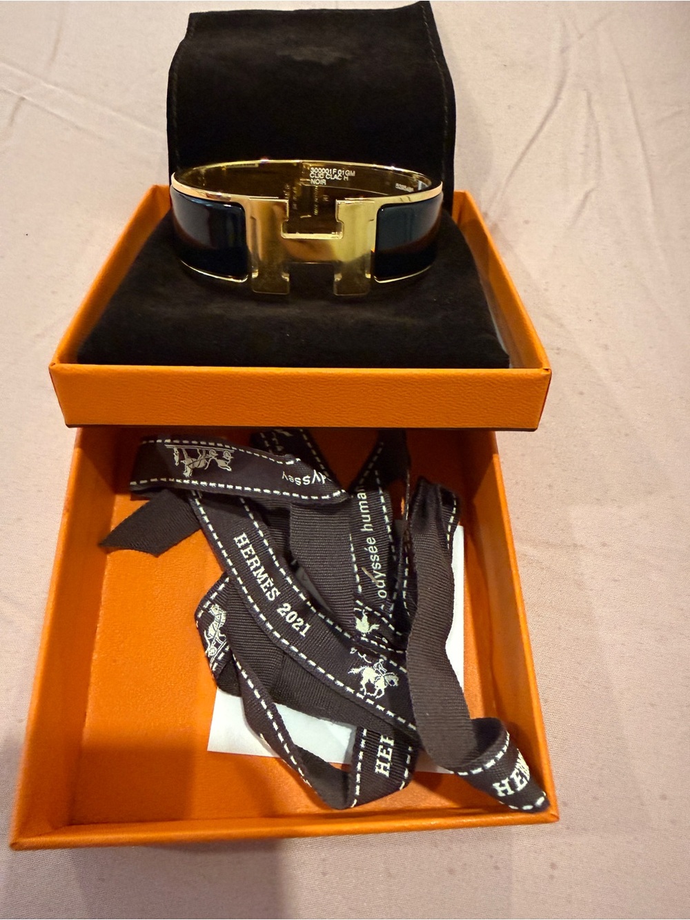 Hermès Clic Clac H Bracelet in Black and Gold